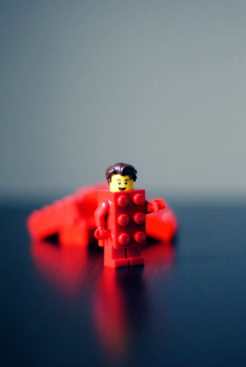 2K, minifigure, number, relaxation, toy, studio shot, selective focus, gray background, still life, leisure games, lego, red, close-up, plastic, colored background