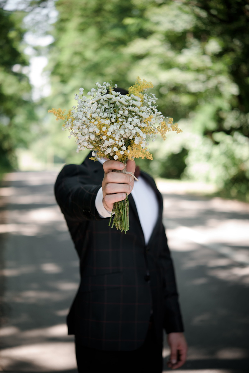 wearing, front, wedding, holding, real people, focus, plant, one person, selective, flowering plant, focus on foreground, groom, freshness, jacket, men