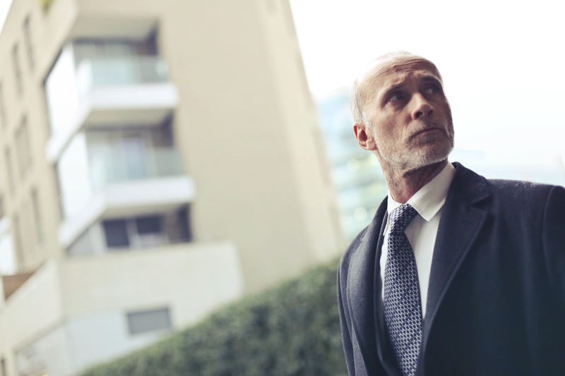 built structure, well-dressed, contemplation, adult, building exterior, fine-looking, portrait, coat, formalwear, windows, one person, photo, mature men