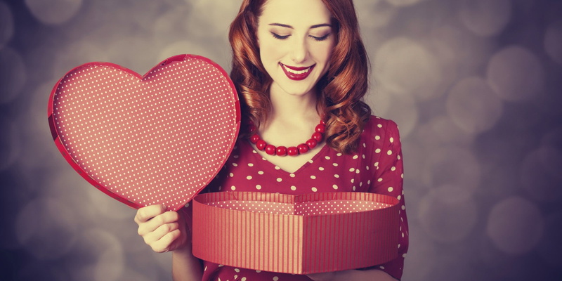 front view, long hair, positive emotion, beautiful woman, polka dots, holding, valentines day - holiday, young adult, box - container, hairstyle, emotion