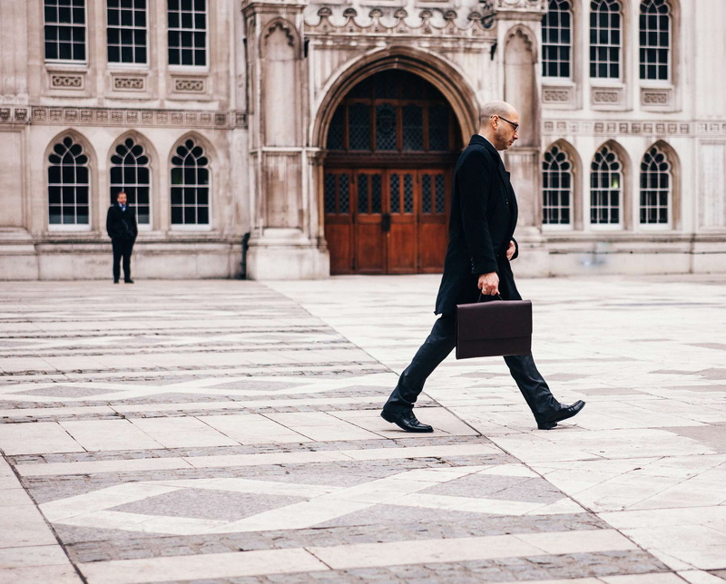 people, attire, day, formal coat, outdoors, lifestyles, full length, facade, doors, walking, adult, built structure, 1080P, footpath, arch, corporate