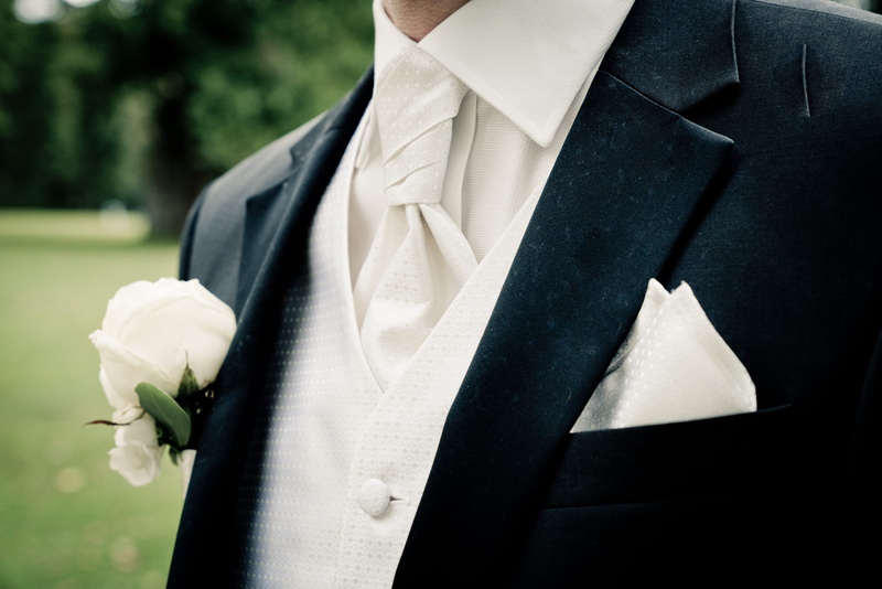 suit, person, clothing, button down shirt, attire, day, formal, marriage, plant, groom, flowering plant, close, man, photography, white color, adult, menswear