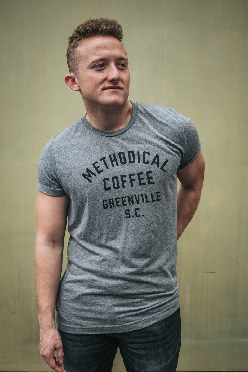people, adult, real people, t-shirt, clothing, prison, sleeve, portrait, indoors, communication, gray, looking away, top, jeans, one person, cabbage, three quarter length