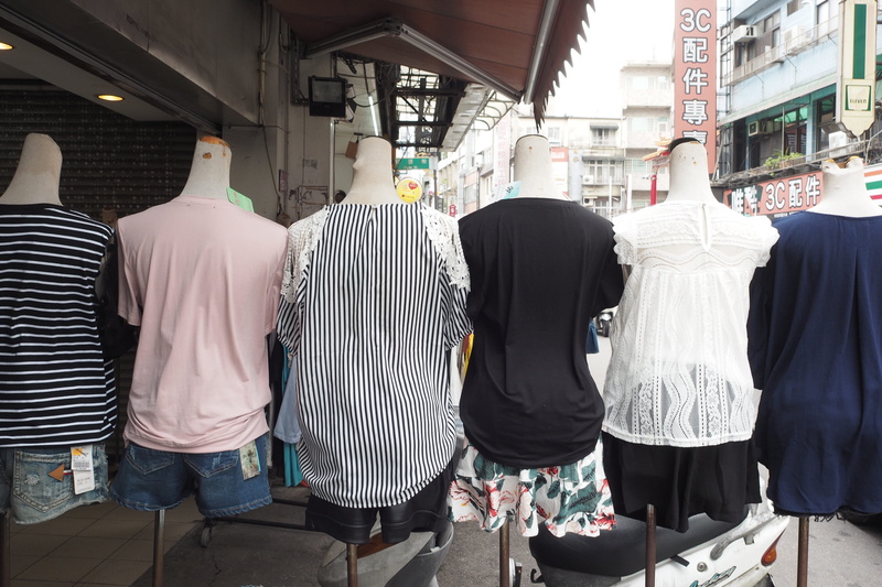 footwear, window display, architecture, lifestyles, outdoors, clothing, sun hat, mannequin, men, person, sleeve, people, back, shorts, group of people