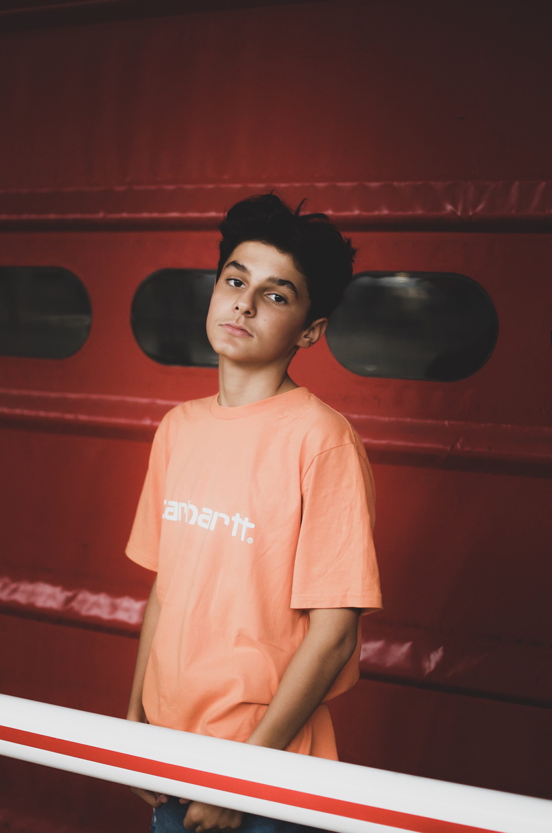 men, front view, handrail, 4K, red, long sleeve, door, female, wearing, portrait, banister, pre-adolescent child, lifestyles, apparel, clothing, orange