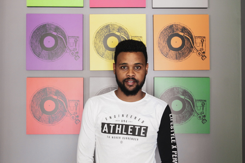 face, photo, males, person, blossom, looking at camera, human, apparel, long sleeve, t-shirt, emotion, sleeve, front view, photography, text, man, smiling