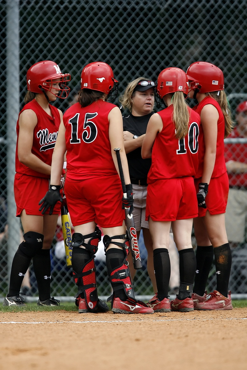 teamwork, athlete, uniform, child, softball, cooperation, clothing, women, legs, fence, team, pony tail, togetherness, athletic, competitive, high school