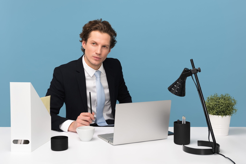 serious, person, sit, lamp, front view, indoors, occupation, work, workplace, plant, men, businessman, looking, cup, working, one person, concentration