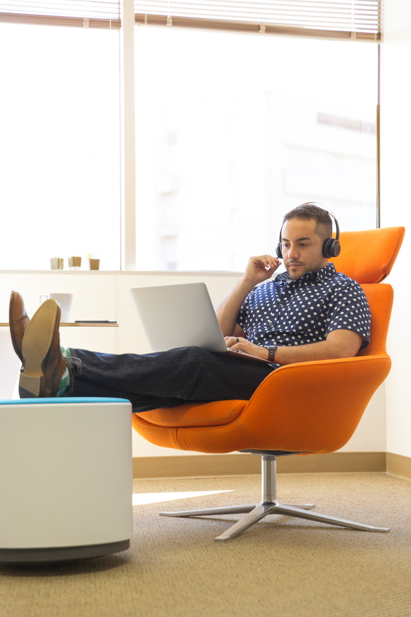 typing, chair, headphones, adult, seat, technology, using, office, using laptop, communication, internet, laptop, working, full length, person, room, wearing
