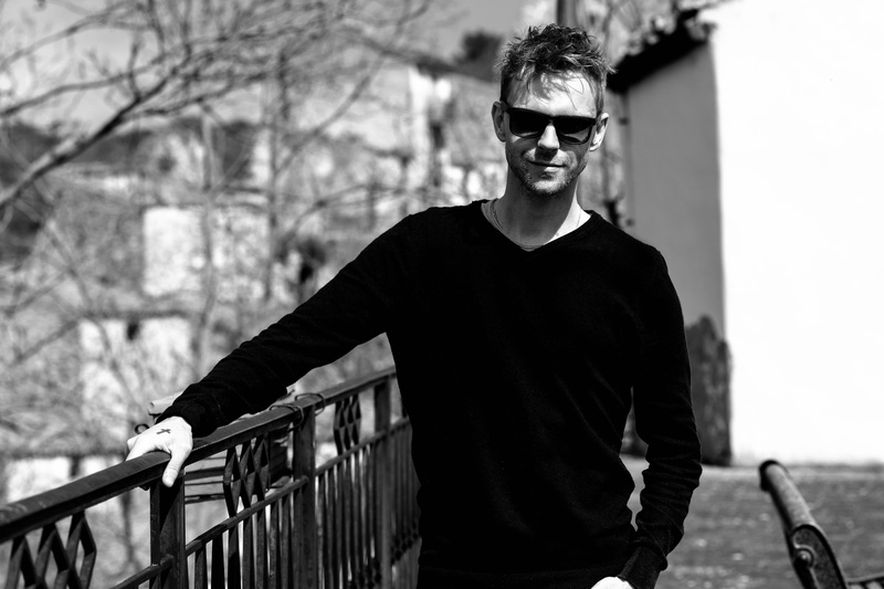one person, sunglasses, young, architecture, smile, front view, looking at camera, summer, travel, glasses, railing, leisure activity, white, lifestyle