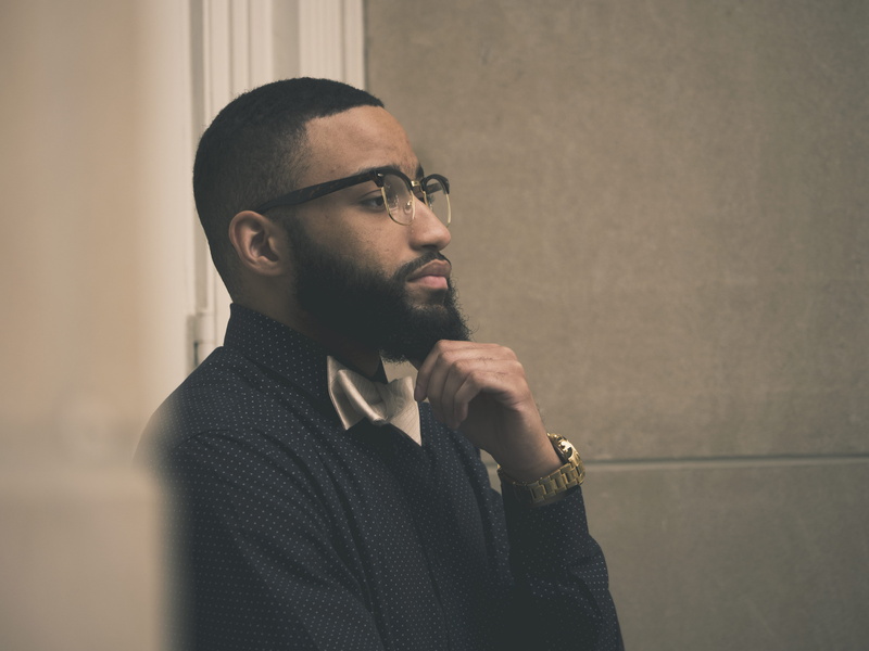 one person, eyeglasses, indoors, fashion, sweater, 5K, leaning, thinking, pose, lifestyles, young men, tie, looking away, person, posing, waist up, profile