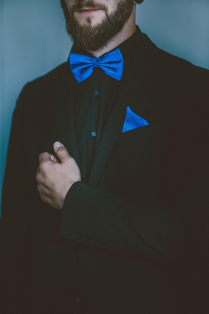 tie, fashionable, beard, shirt, blue, lifestyles, indoors, black, young men, standing, fashion, formalwear, hand, fly, elegant, tuxedo, clothing, button down shirt