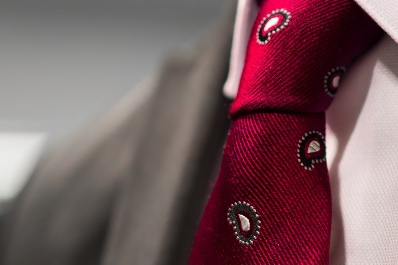 indoors, clothing, textile, tie, 2K, red, fashion, elegance, human body part, wearing, class, pink color, necktie, person, adult, luxury, paisley, people