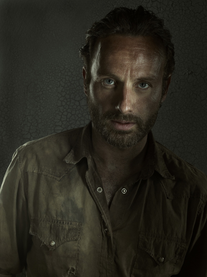 headshot, looking at camera, emotion, button down shirt, gray, one person, indoors, contemplation, Andrew Lincoln, black background, Rick Grimes, portrait