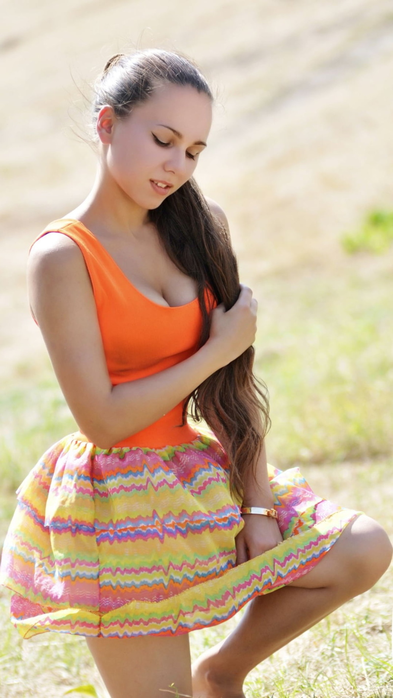 kneeling, looking below, skirt, women outdoors, Ukrainian, women, portrait display, brunette, 1080P, ponytail, tank top, holding hair, long hair, cleavage