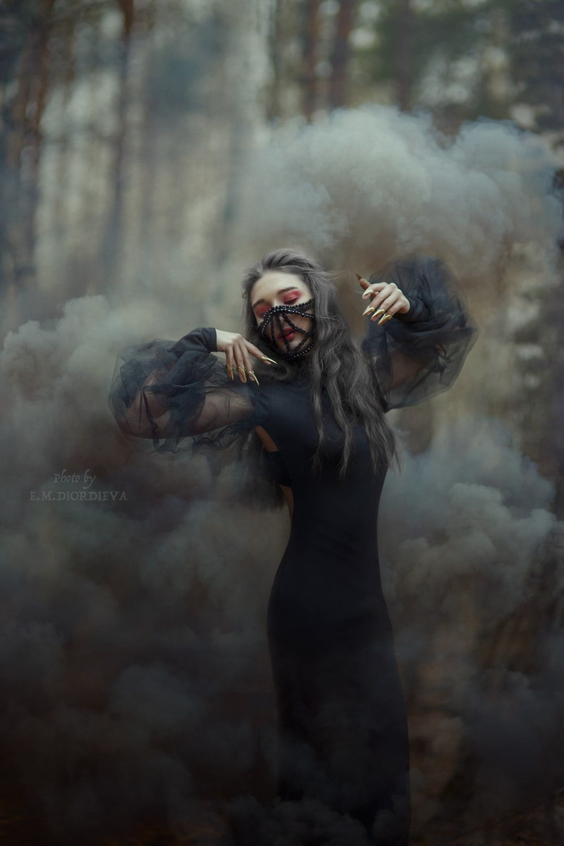 arms up, vertical, black dress, women outdoors, long nails, young woman, looking below, brunette, forest, eyeshadow, mask, bokeh, lipstick, women, watermarked