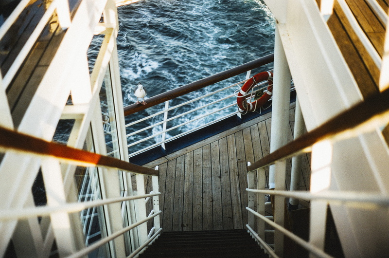 boat deck, stairs, high angle view, sea, water, day, travel, boat, downstairs, no people, transportation, seagull, railing, sailing, outdoors, mode of transportation