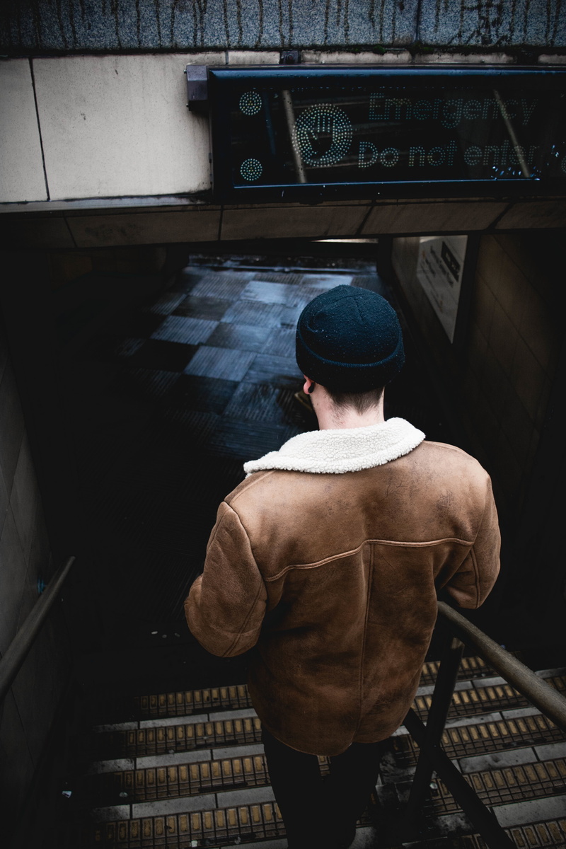 working, hat, stairs, real people, rear view, back, warm clothing, people, dark, guy, cap, staircase, three quarter length, leather, beanie, walking, men