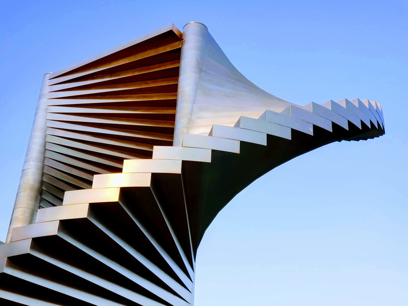 low angle view, shape, sunlight, built structure, sky, clear sky, creativity, outdoors, 4K, architecture, no people, pattern, metal, spiral, blue, design