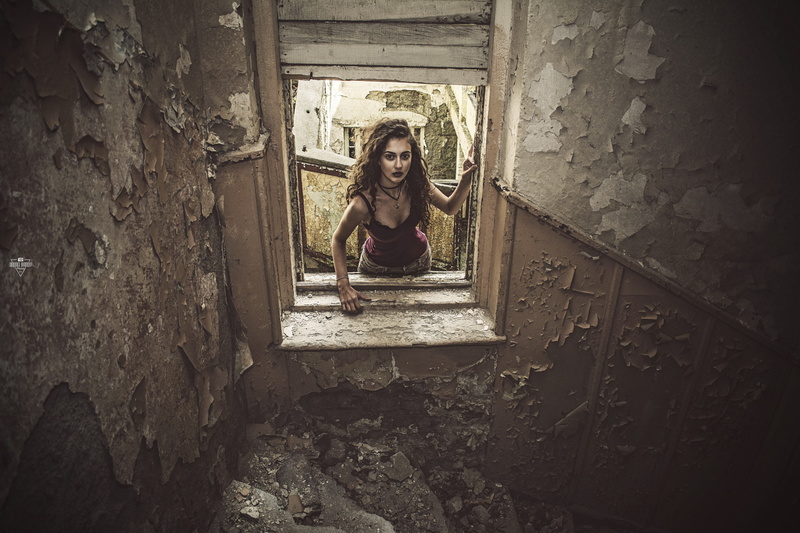 built structure, 1080P, ruin, looking at camera, deterioration, casual clothing, portrait, abandoned, front view, real people, stone wall, staircase, leisure activity