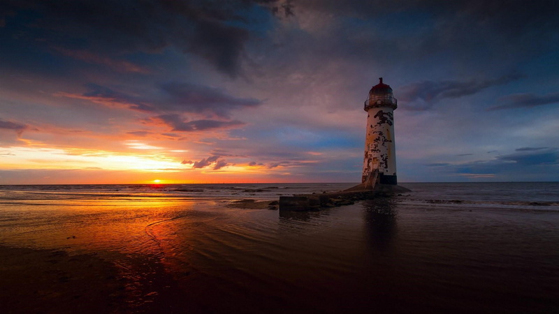 land, sea, tower, horizon, building exterior, horizon over water, built structure, sky, tranquil scene, point of ayr lighthouse, guidance, no people, cloud - sky
