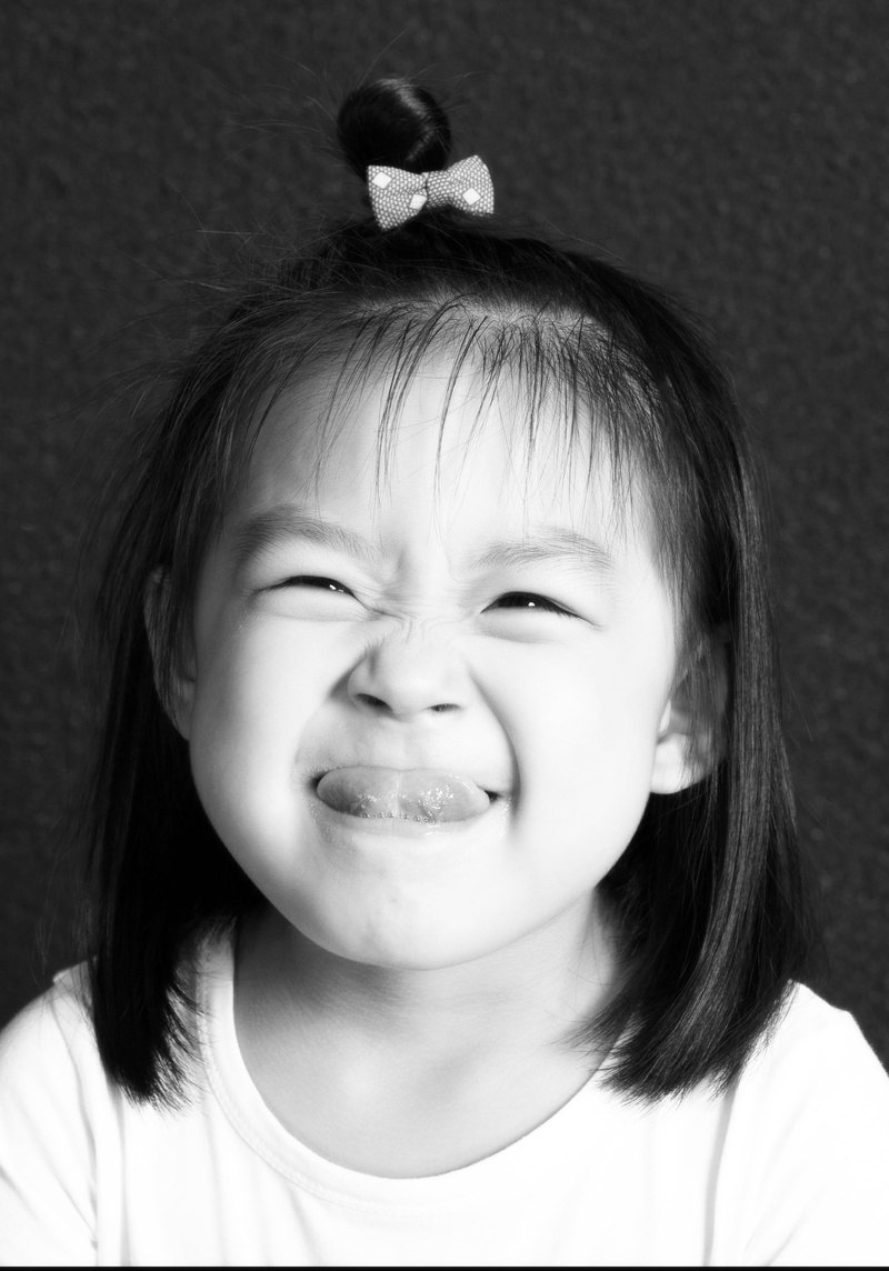 real people, human face, six one, cheerful, close-up, innocence, cute, child, black And White, front view, smiling, mouth open, indoors, lifestyles, eyes closed