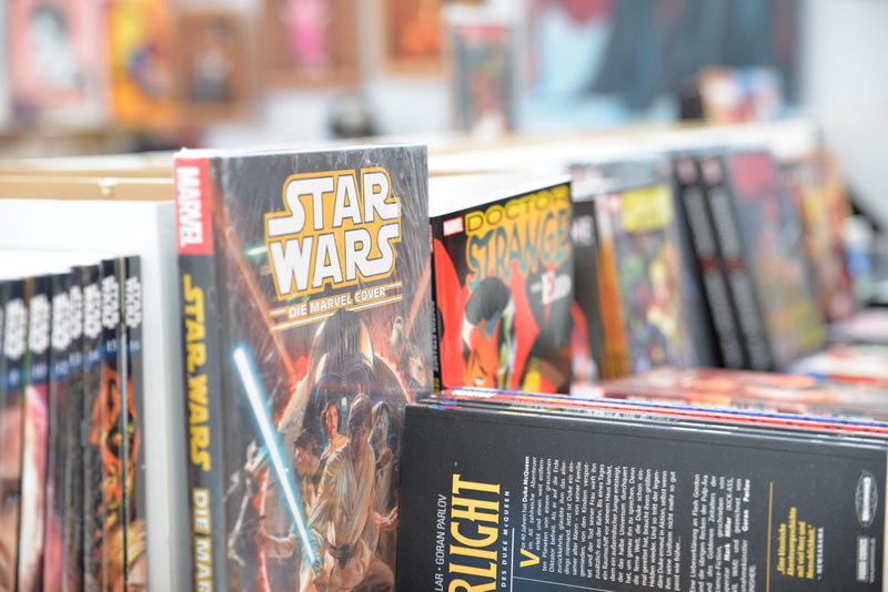 market stall, Comics, no people, communication, store, small business, market, retail display, day, outdoors, Star Wars, consumerism, Comic-Con, groceries