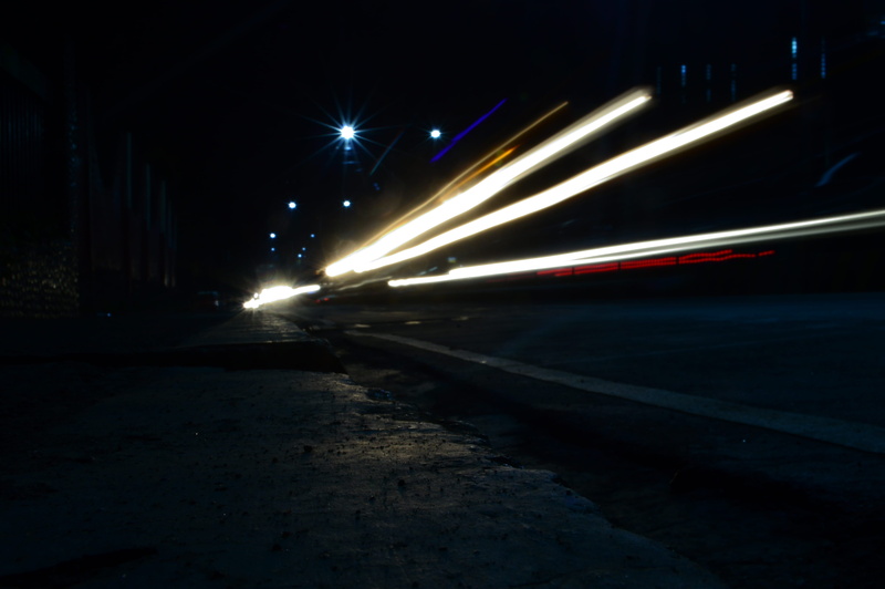 architecture, mode of transportation, direction, exposure, blurred motion, city, no people, outdoors, lighting equipment, lights, illuminated, light trail