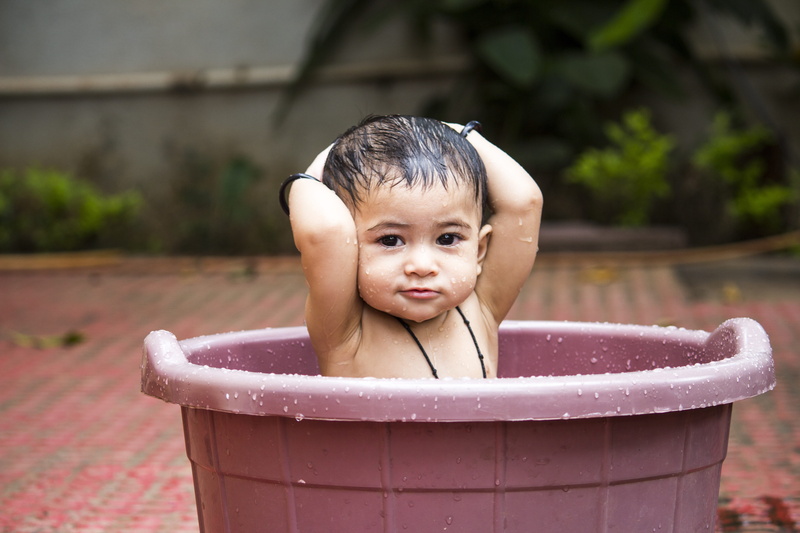 pail, outdoors, one person, domestic room, cleaning, childhood, looking at camera, baby bathing, water, kid, 5K, headshot, domestic bathroom, hygiene