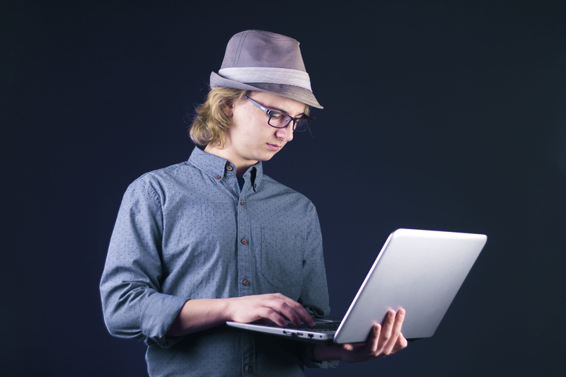 one person, office, using laptop, people, technology, man, glasses, portrait, black background, business, internet, wireless, adult, waist up, connection