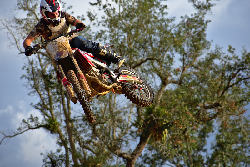 people, action, dirtbike, low angle view, muddy, airborne, riding, wood, rider, outdoors, motocross, dirty, sport, ramp, skill, sky, outdoorsman, leisure activity