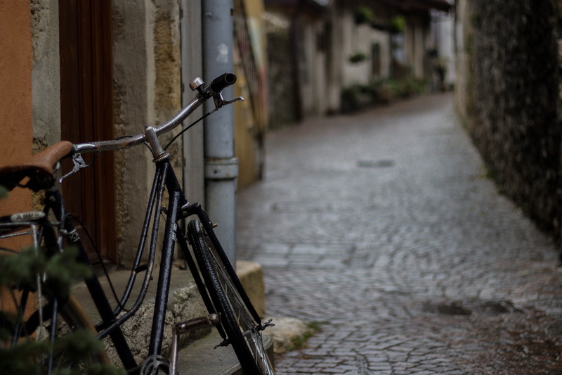 wall, rain, land vehicle, focus, stationary, outdoors, no people, cruiser, mode of transportation, built structure, water, street view, black, streetwalk
