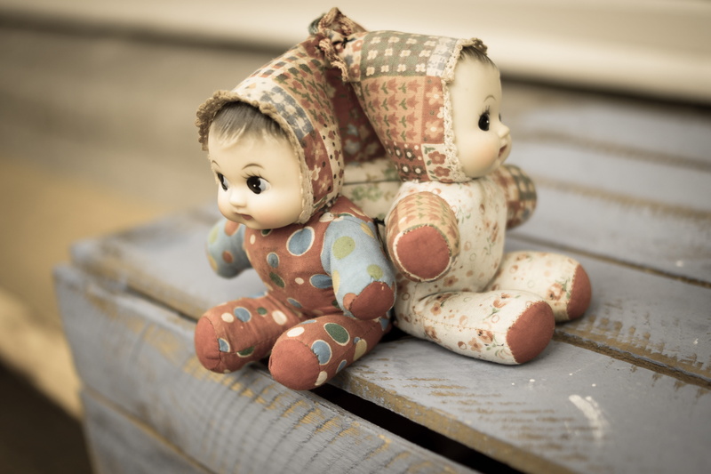three, cloth, puppets, human representation, toys, female likeness, dolls, indoors, souvenir, ceramic, representation, doll, table, antique, no people