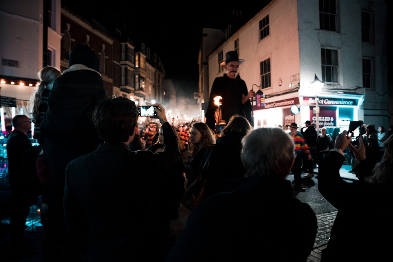 adult, 4K, illuminated, architecture, crowd, hastings, leisure activity, united kingdom, building exterior, arts culture and entertainment, men, lifestyles