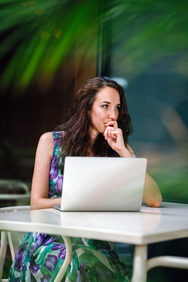 desk, outdoors, focus, table, using, 8K, long hair, photoshoot, contemplation, one person, connection, lady, depth of field, women, seat, adult, sit, communication