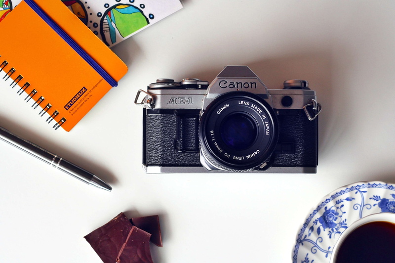 camera - photographic equipment, antique, close-up, technology, photography, table, cup, text, no people, classic, notepad, photographic equipment, coffee