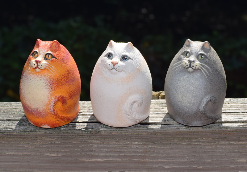 group of animals, decoration, white, wellbeing, food, wood - material, clay, figurines, sculpture, cute, three objects, table, colorful, cat, craft, silver colored