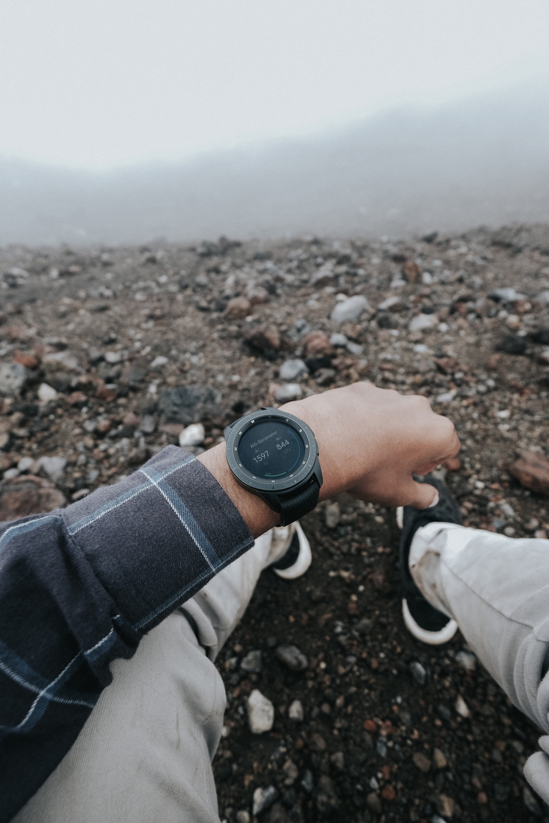 finger, rubble, real people, camera, smartwatch, clothing, human hand, man, human body part, money, wearing, camera - photographic equipment, body part