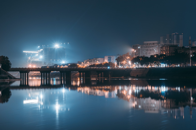 dock, residential district, calm, bridge, building, travel destinations, illuminated, light, skyscraper, body, nature, port, moat, fort, outdoors, power plant