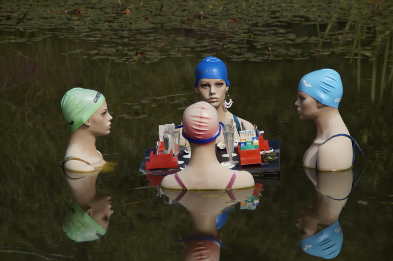 three quarter length, female, table, art, dolls, nature, 5K, leisure activity, chat, day, mannequins, swim cap, surrounding, water, mirroring, representation