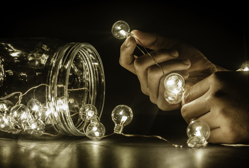 human body part, indoors, studio shot, hand, one person, light bulb, jar, holding, small light, table, dark, lights, illuminated, men, adult, light bulbs