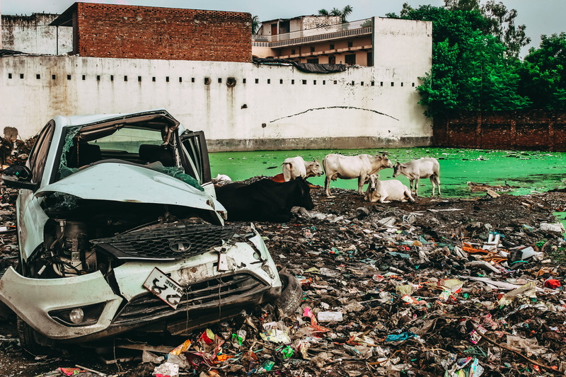 tire, car, trash, nature, alloy wheel, 5K, occupation, residential district, adult, damaged, four, obsolete, building exterior, car wheel, white, outdoors