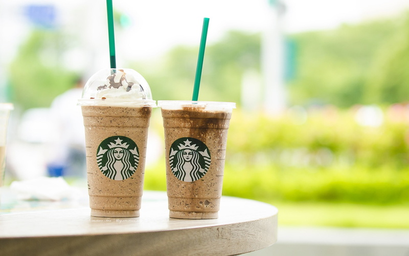 no people, coffee, growth, brand, finance, food, nature, close-up, container, plant, freshness, day, business, starbucks, table, outdoors, green color