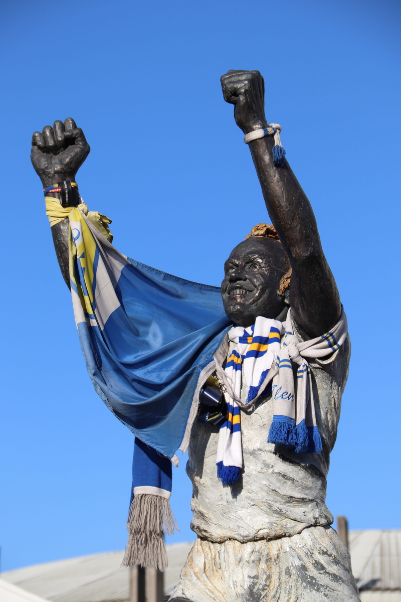 low angle view, patriotism, human representation, clear sky, day, soccer, football, craft, sky, creativity, art and craft, billy bremner, no people, sculpture