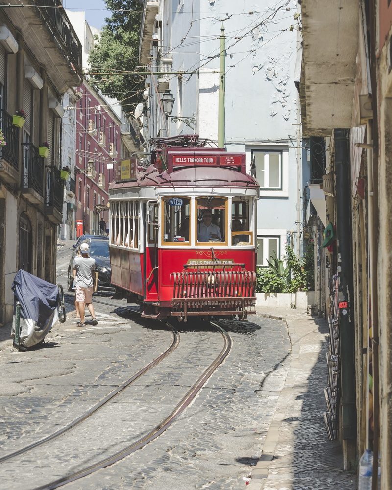 pavement, red, land vehicle, built structure, tourism, incidental people, architecture, track, buildings, public transportation, public transport, vintage