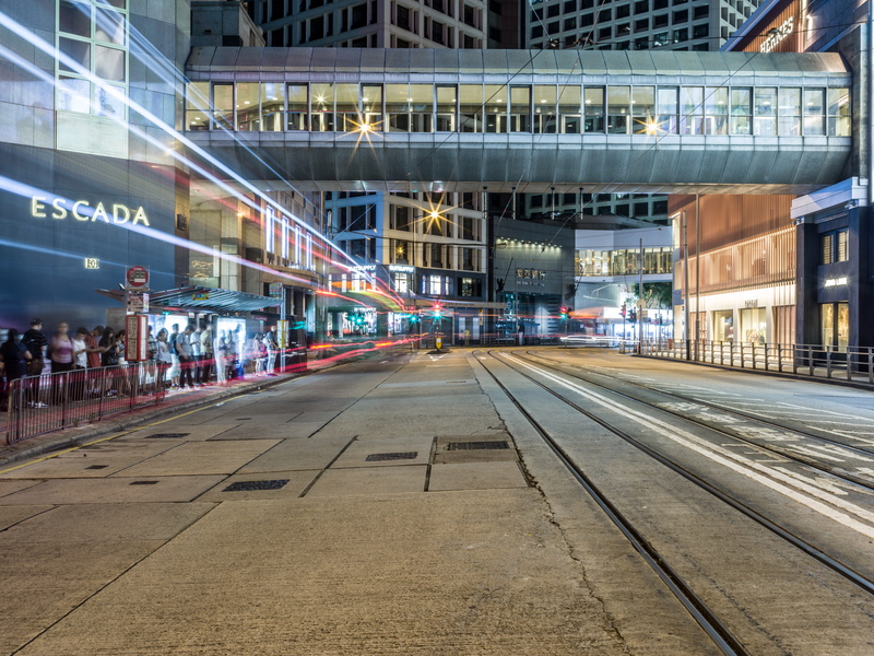 light streaks, street, track, day, road, mode of transportation, railroad track, building, 8K, buildings, building exterior, city, incidental people, tram lines