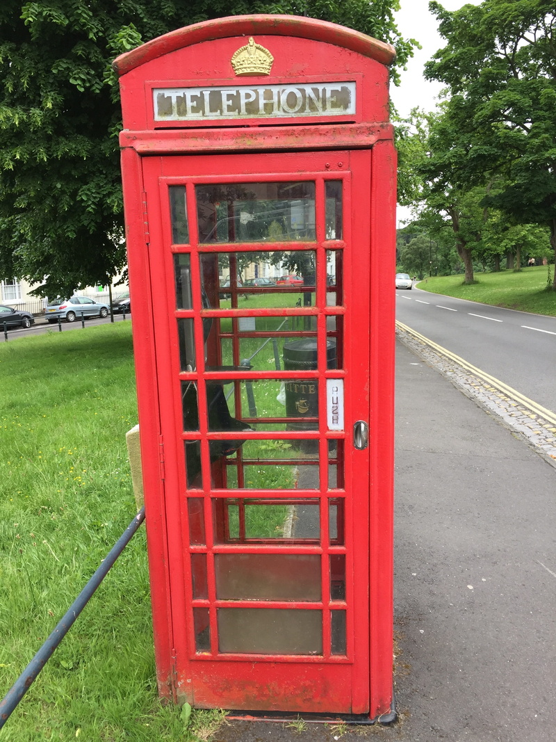 no people, pay phone, grass, red, telephone, tree, text, outdoors, phone booth, plant, day, public, convenience, 2K, telephone booth, connection, telephone house
