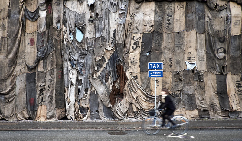 torn, beside, movement, wall, riding, brown, cycling, street, one person, day, bicycle, kerb, texture, cyclist, communication, photo, cloth, motion, fabric