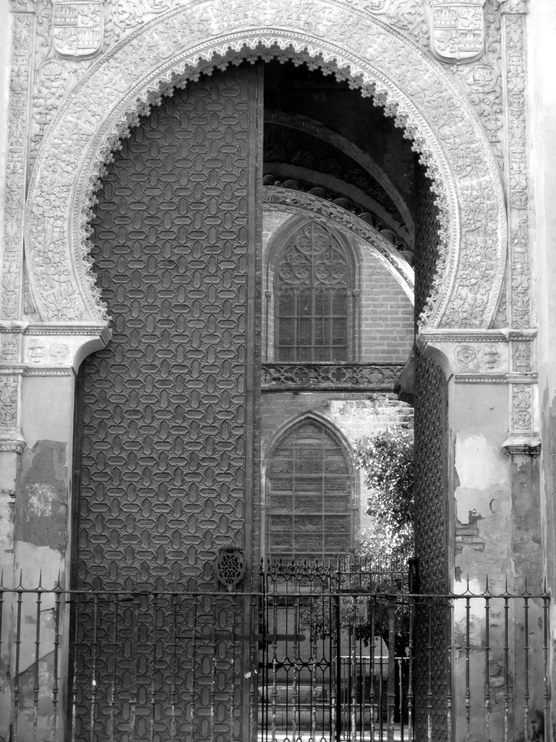 belief, carving - craft product, outdoors, travel destinations, city, entrance, wall, built structure, door, spain, old, religion, seville, place of worship