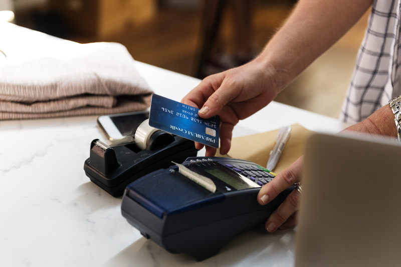 education, occupation, holding, indoors, payment, 5K, finger, credit card, cellphone, card, person, man, communication, selective focus, business, connection